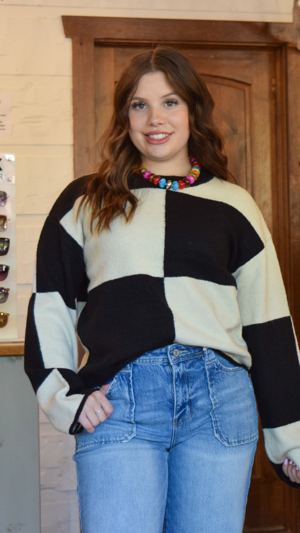 Cream and black checkered sweater