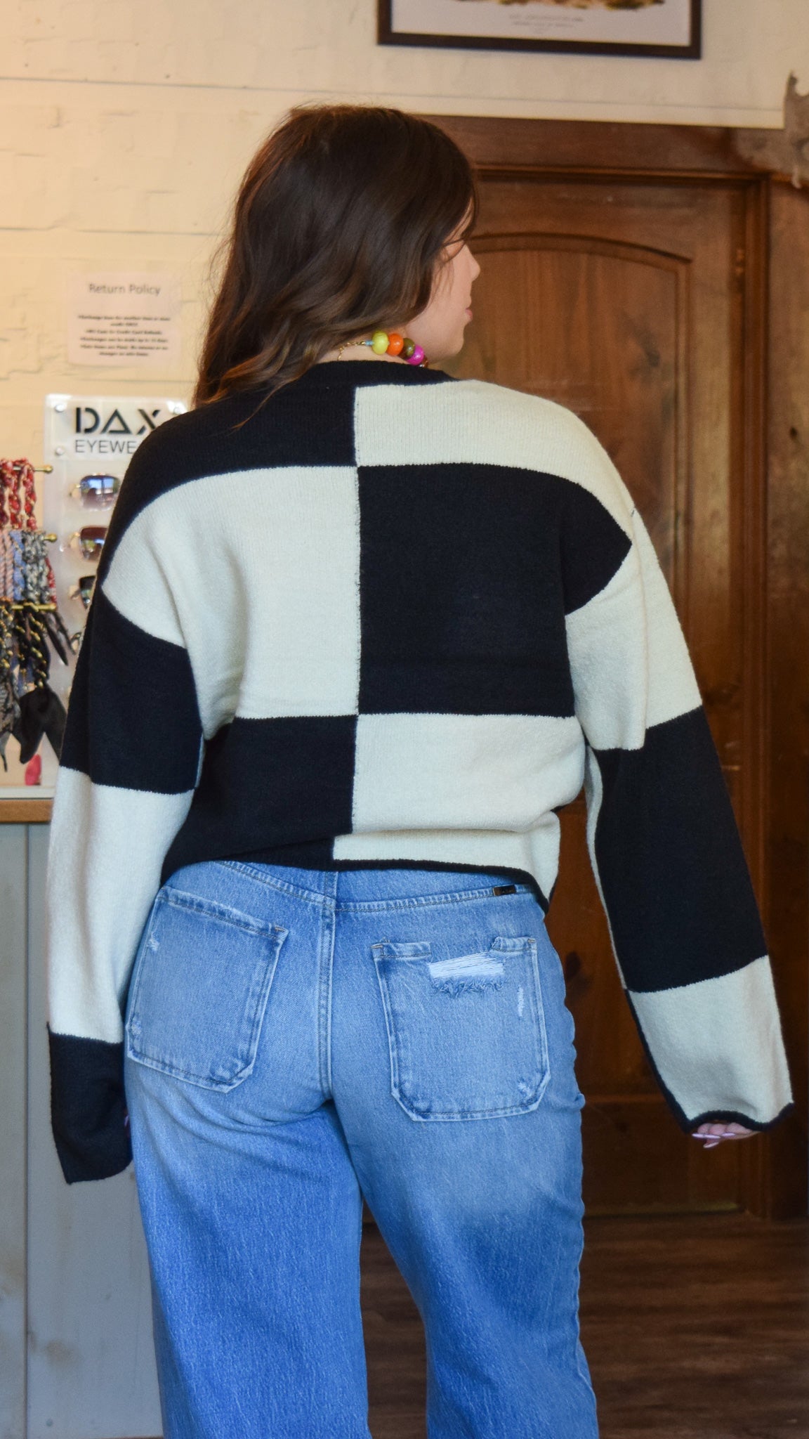 Cream and black checkered sweater