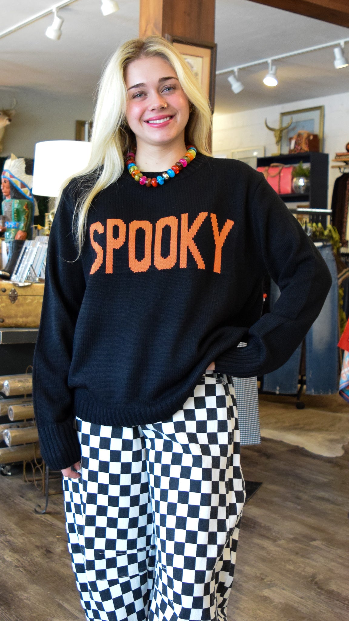 Black and orange "SPOOKY" knit sweater