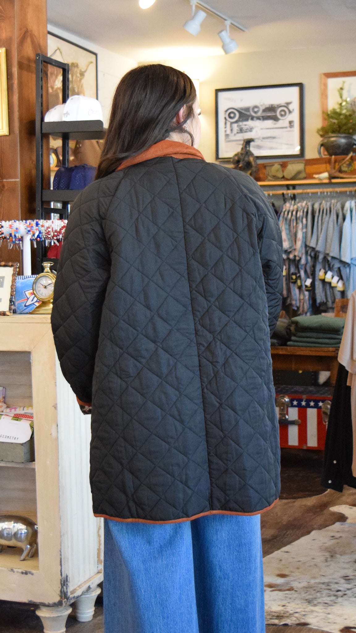 Black quilted jacket featuring a brown corduroy collar and leopard-print lining